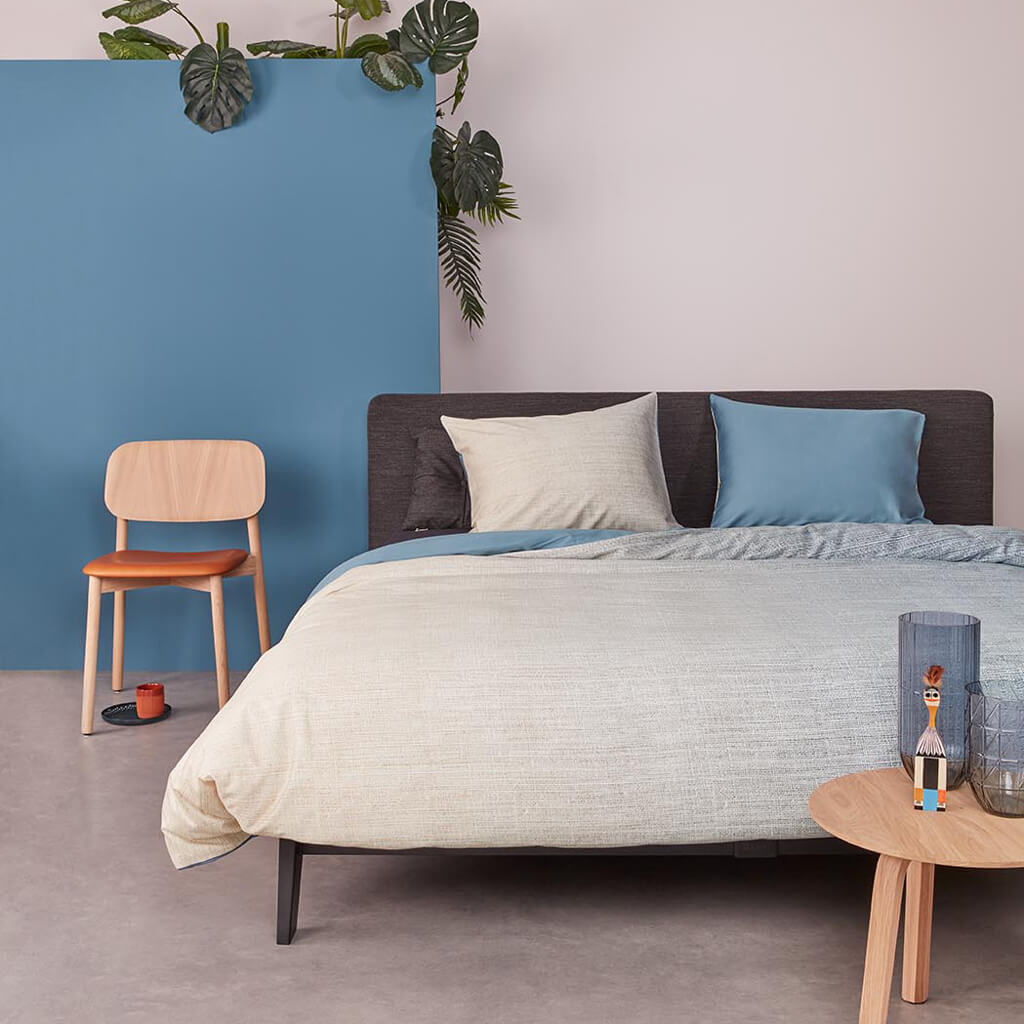 Odyssey dekbedovertrek blue on an Auping bed
